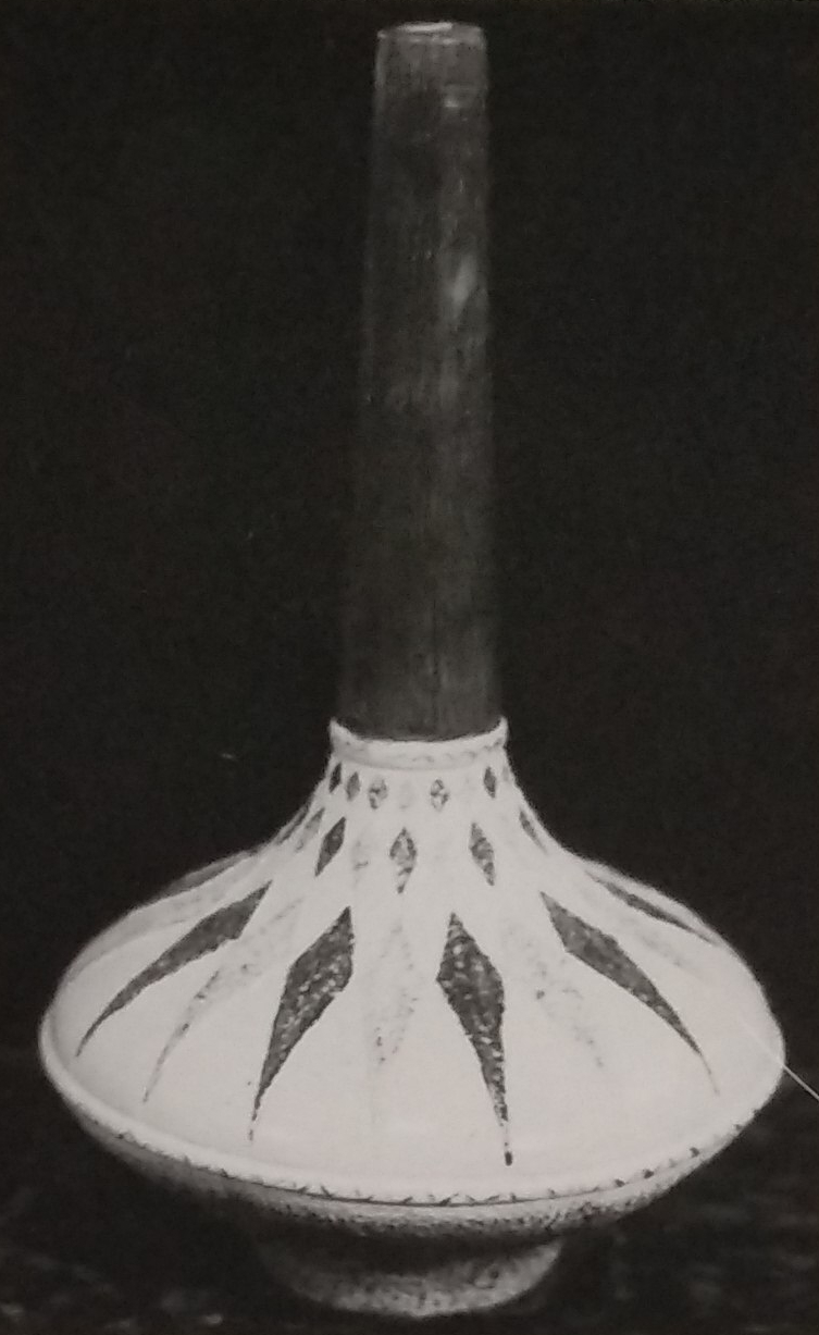 White standard lamp with light and dark patterns. Main column is dark