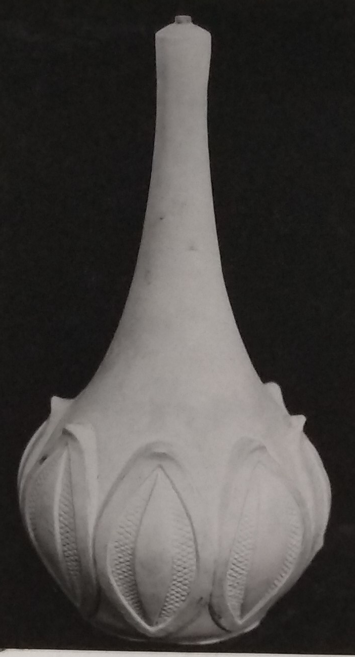 White standard lamp with leaf pattern along the base