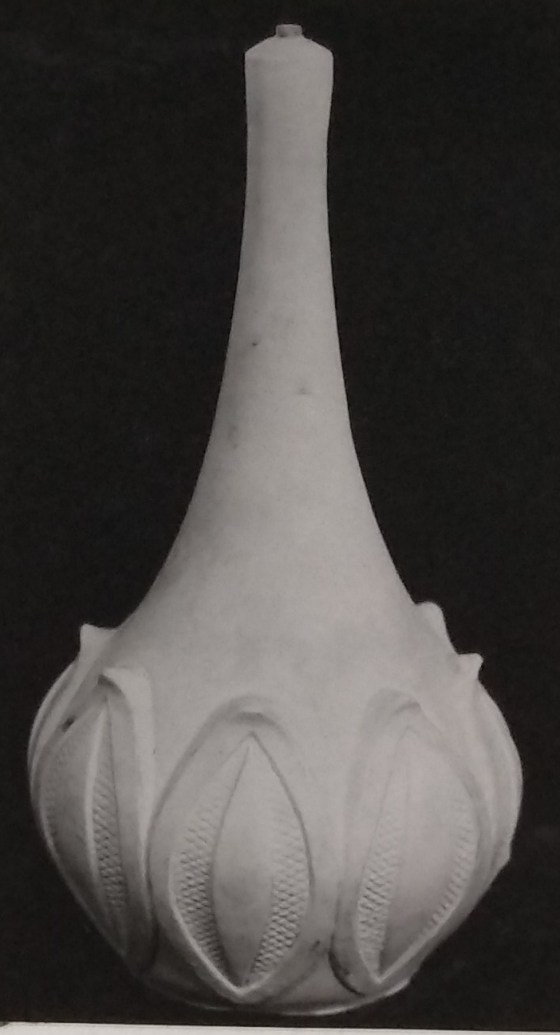 White standard lamp with leaf pattern along the base