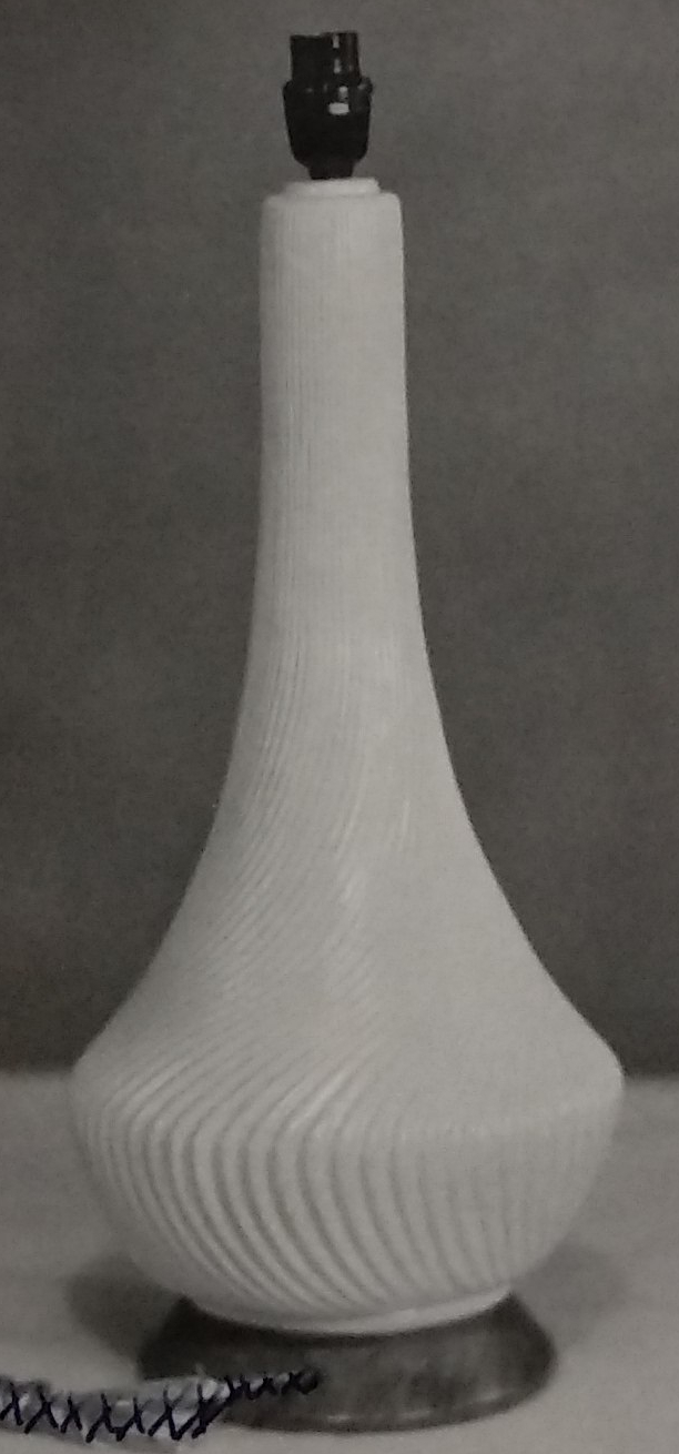 White standard lamp with light wavy lines