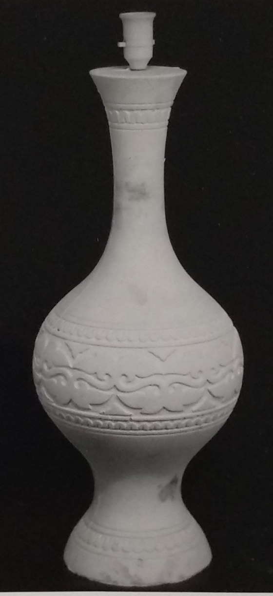 White standard lamp with simple etched carving around the centre