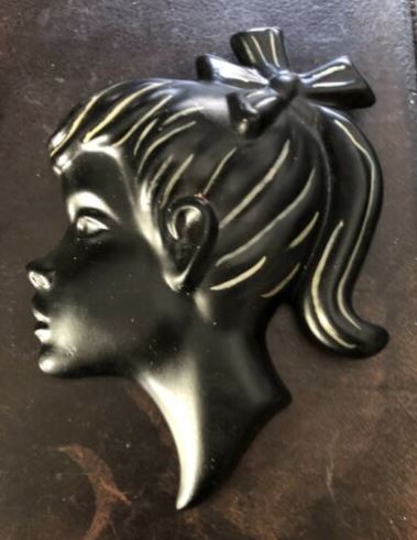 A Duron wall plaque of a girl